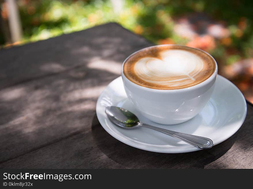 White Ceramic Cup Filled With Latte