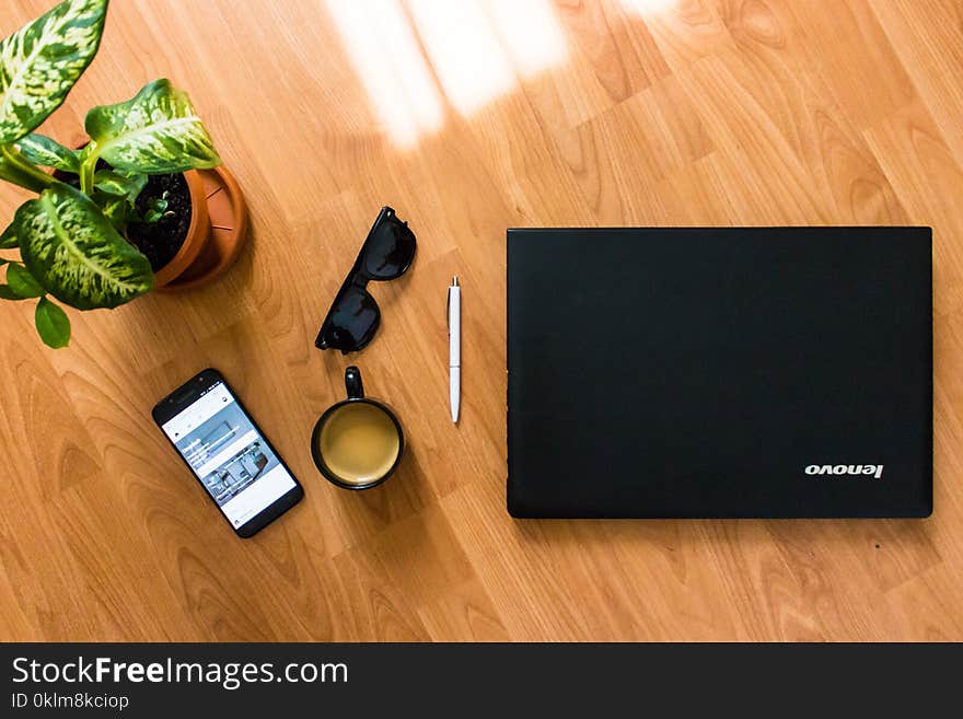 Black Android Smartphone Near Black Coffee Cup