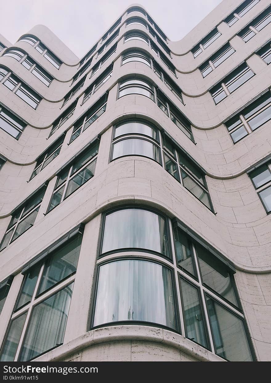 Low Angle Photography of Gray Concrete Building at Daytime