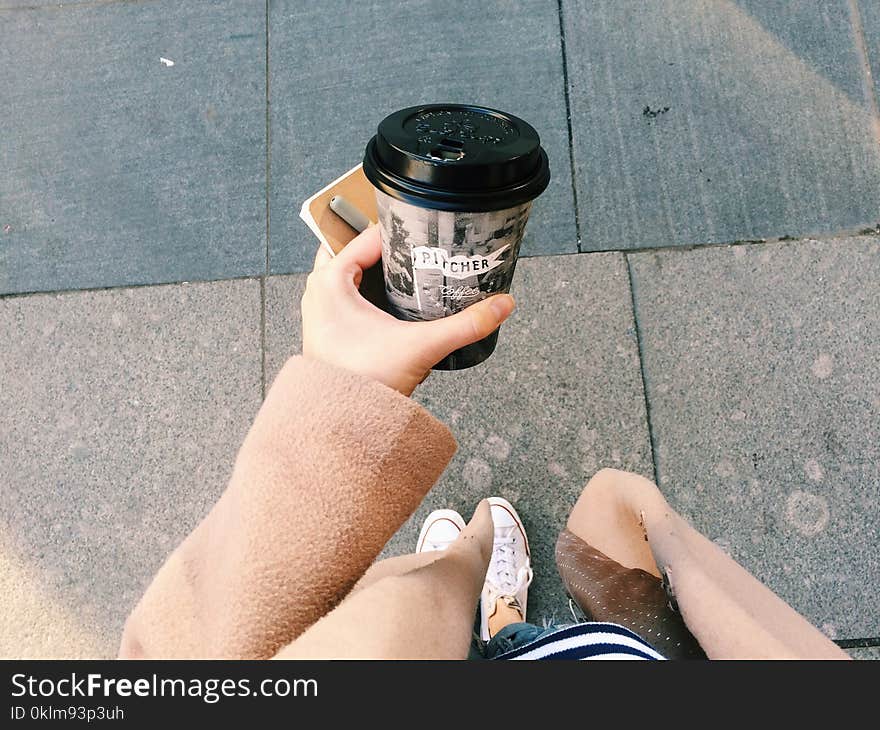 Person Holding Gray Disposable Cup