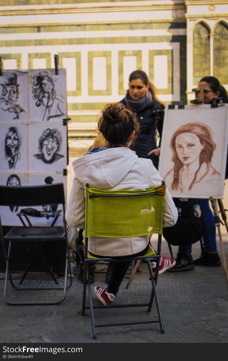 Woman Sitting on Green Chair Drawing