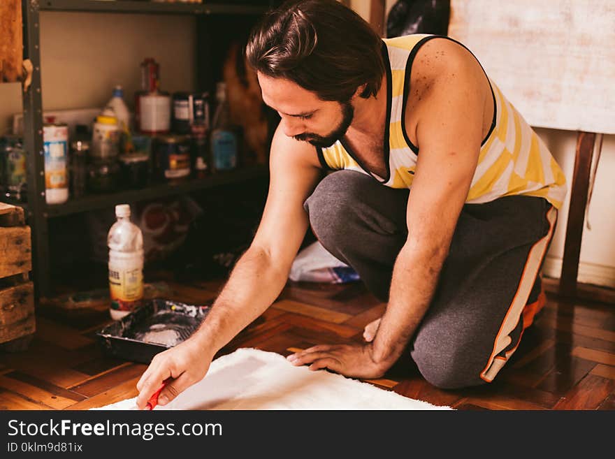 Man in Yellow and White Striped Sleeveless Top