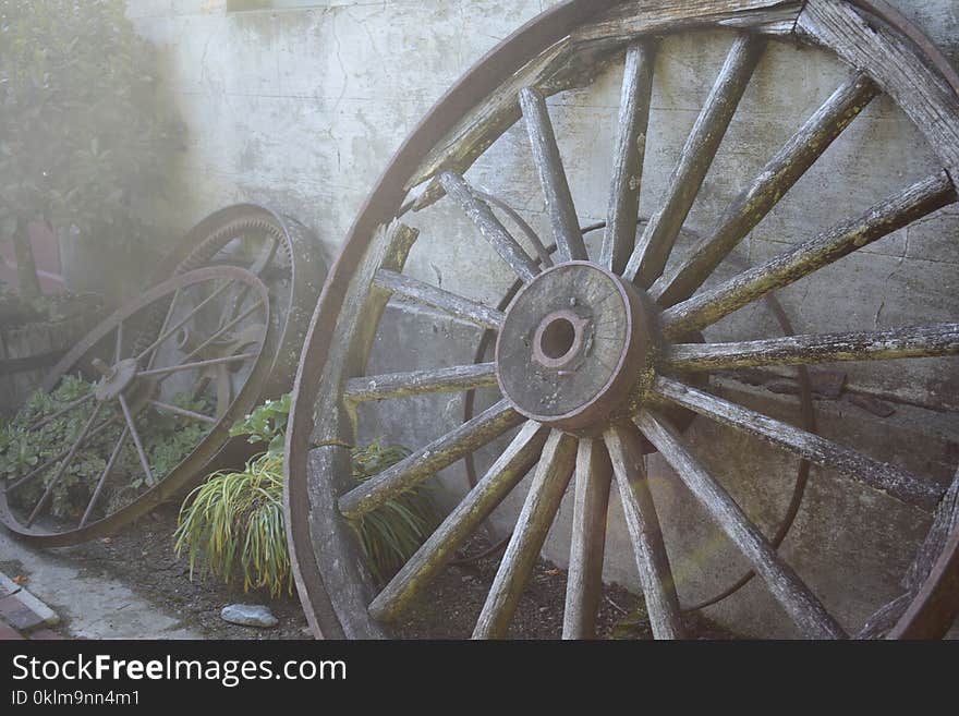 Gray Multi-spoke Wheel Leaning on Wall