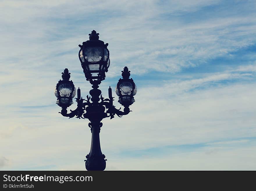 Black 3-in-1 Metal Post Under Blue and White Sky