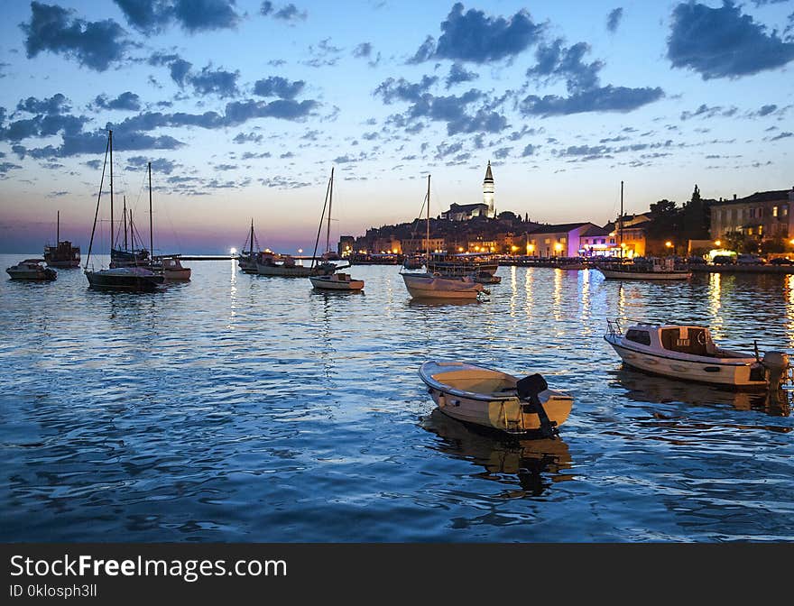 Night view of beautiful town Rovinj in Istria, Croatia. Evening in old Croatian city, night scene with water reflections