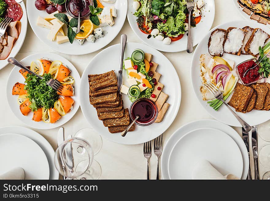 Catering table set service with silverware and glass stemware at restaurant before party. Catering table set service with silverware and glass stemware at restaurant before party