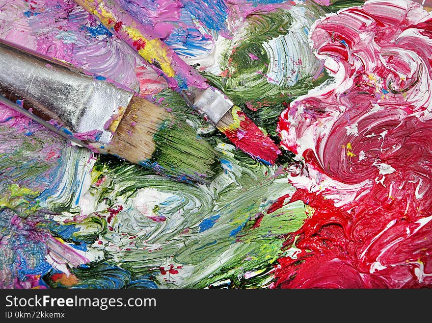 A Palette Of Artists And Brushes. Brush Strokes Close Up.