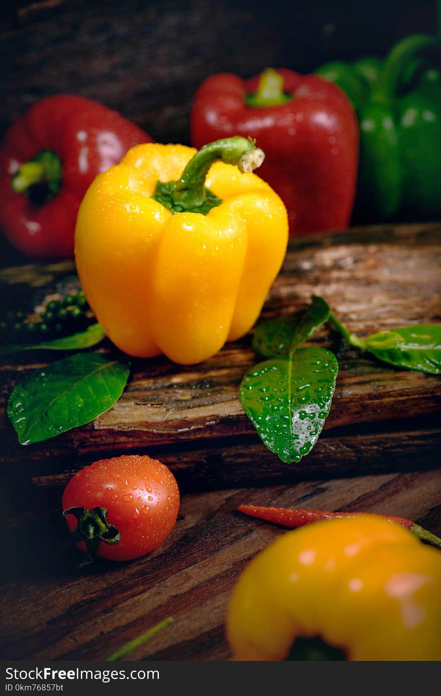 Bell pepper with vegetables on the old wooden floor