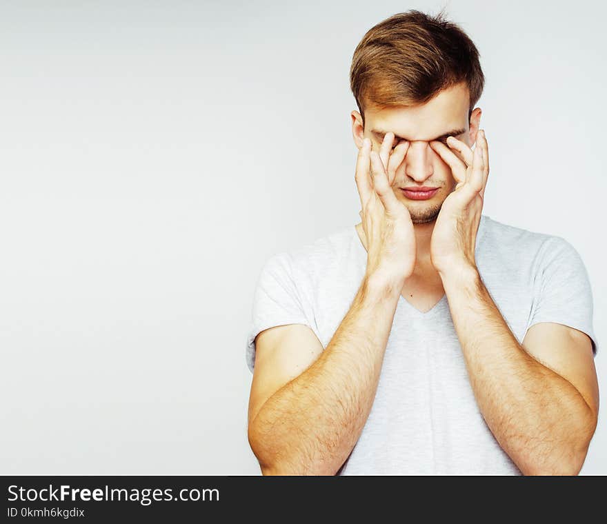 Young handsome teenage hipster guy posing emotional, happy smiling against white background isolated, lifestyle people concept close up