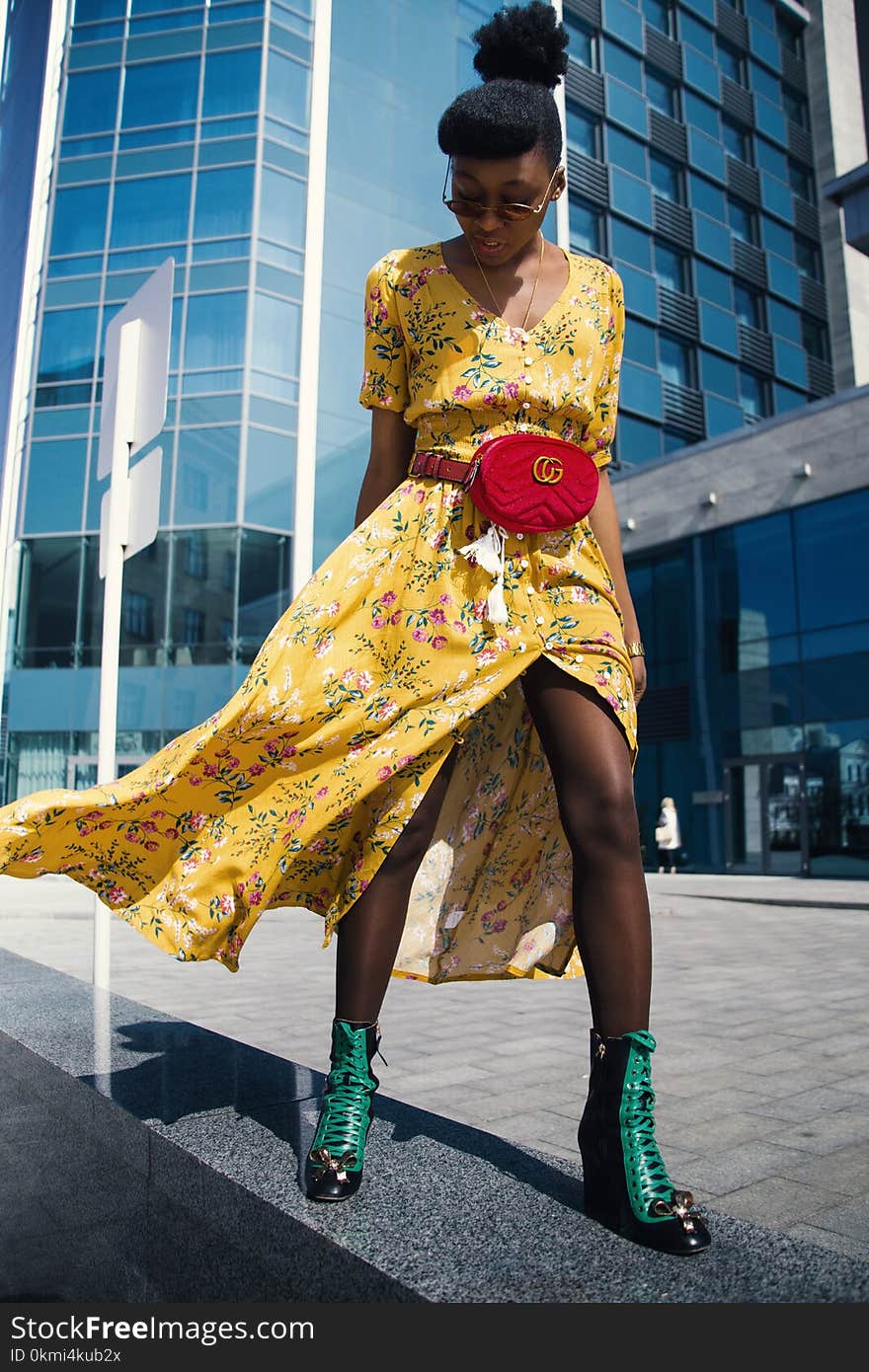 Woman Wearing Yellow Floral V-neck Long Dress and Pair of Green Wedge Sandals