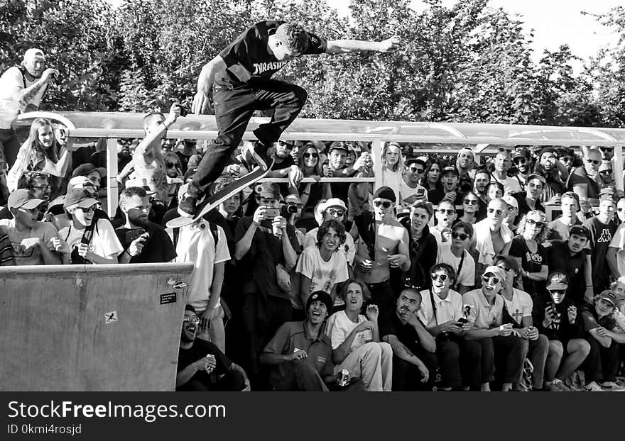 Grayscale Photography of Man Doing Ollie