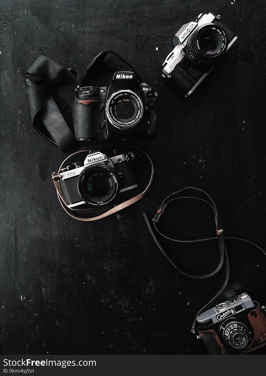 Three Black and Gray Dslr and Slr Cameras