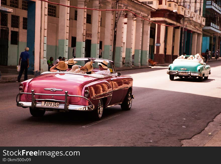 Girls Riding on Red Convertible Coupe