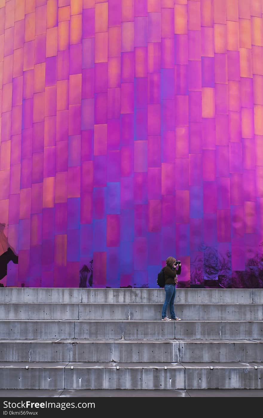 Woman Standing on Stair Taking Picture