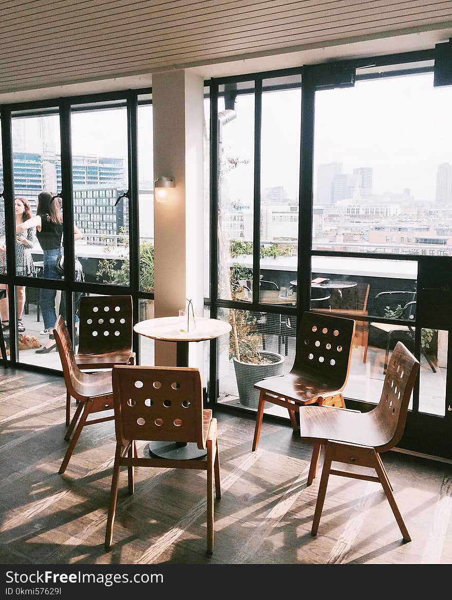 Empty Brown Table With Four Chairs Set