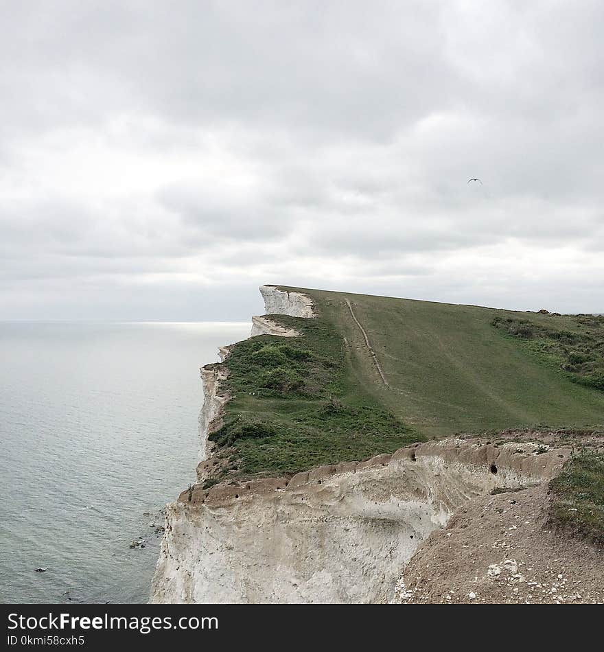 Hill Beside Body of Water