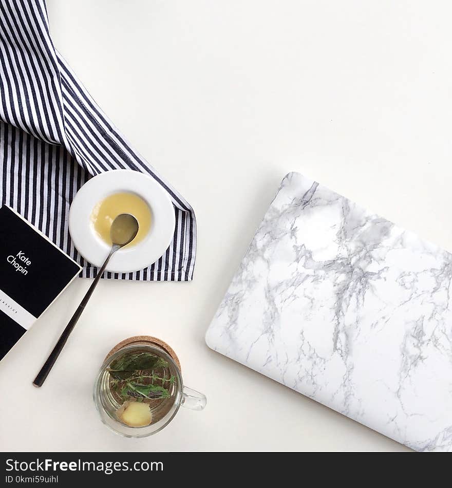 Clear Glass Cup With Tea on Table