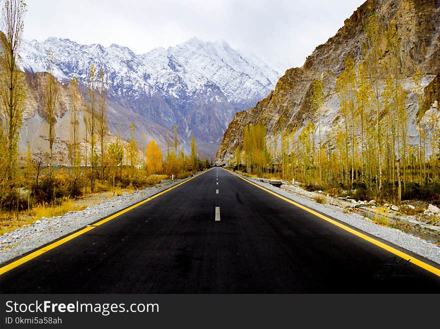 Asphalt Road Between Rock Mountains