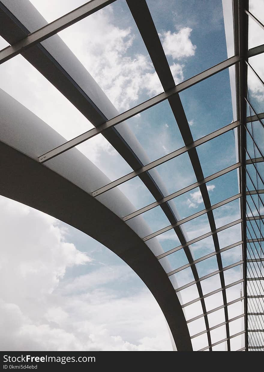 Low-angle Photography of Building Under White Clouds and Blue Sky