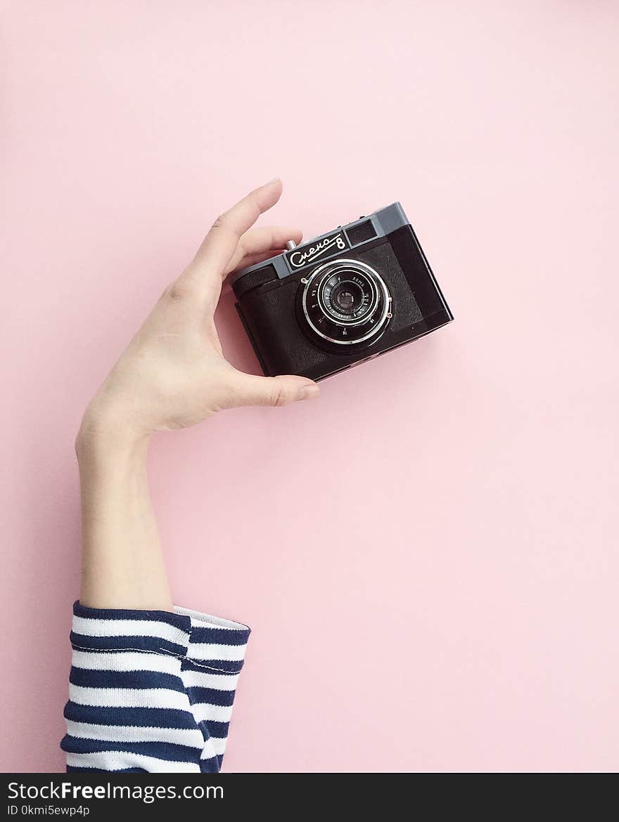 Person Holding Black Point-and-shoot Camera