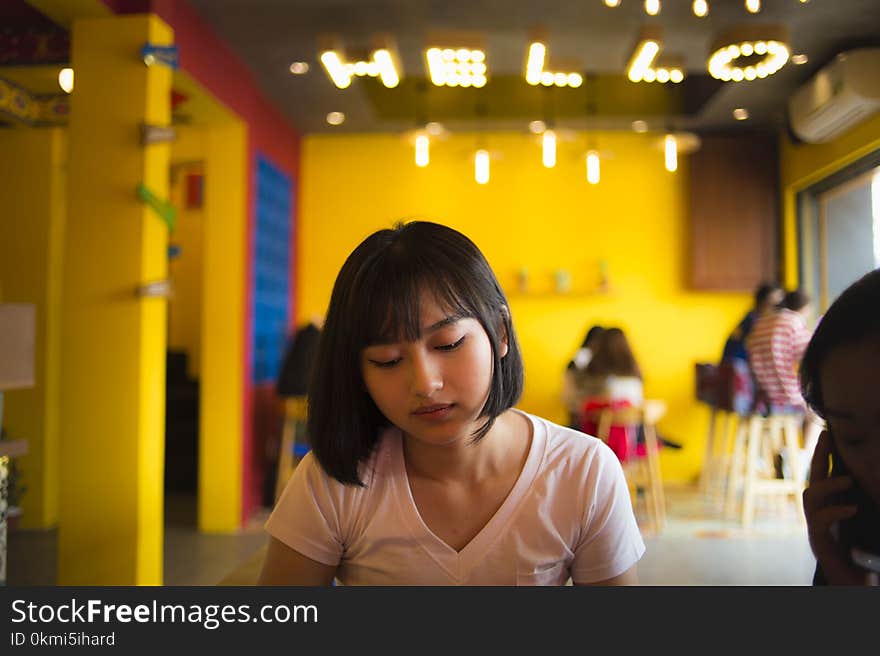 Selective Focus Photography of Woman Wearing Pink V-neck Shirt