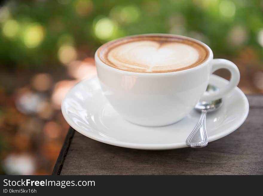 Latte on White Ceramic Cup With Saucer in Macro Photography