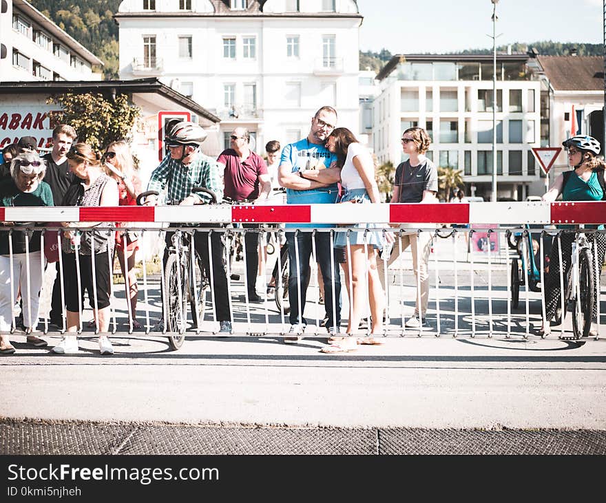 People Standing Near Handrail