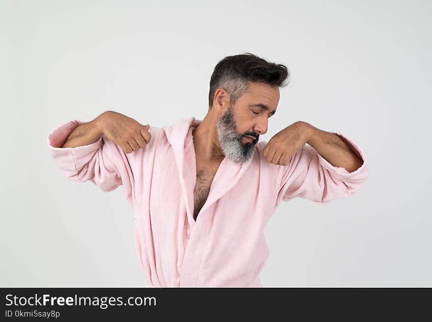 Man Wearing Pink Bathrobe With Both Hands on Shoulder