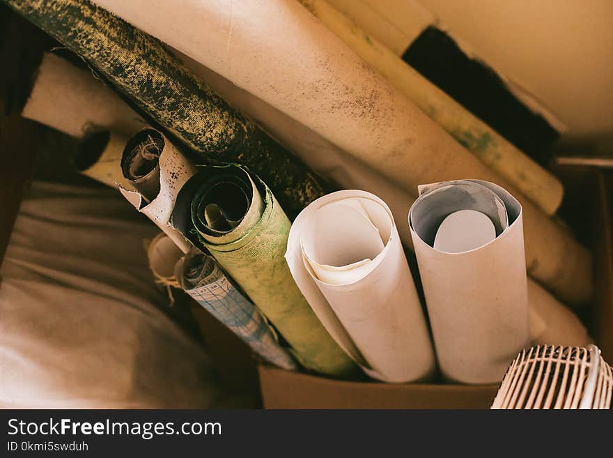 Assorted-color Rolled Paper Beside White Textile