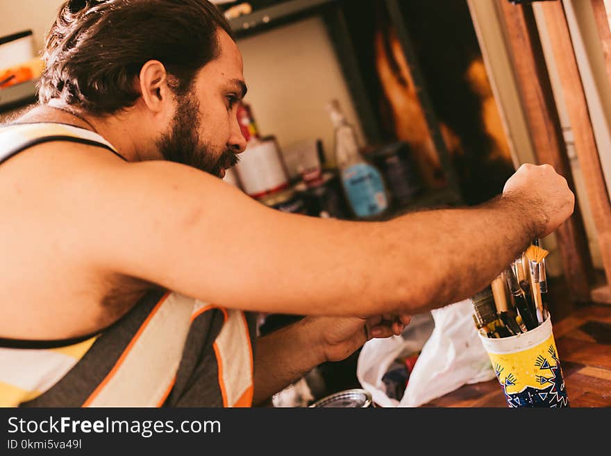 Man Wearing White and Black Tank Top