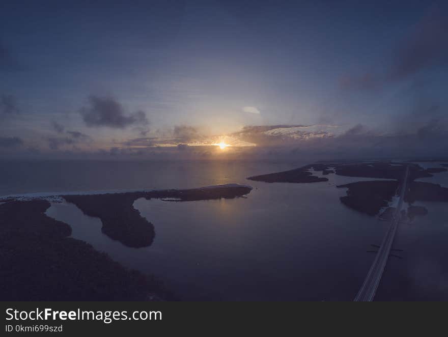 Gray Suspension Bridge Surrounded With Islets