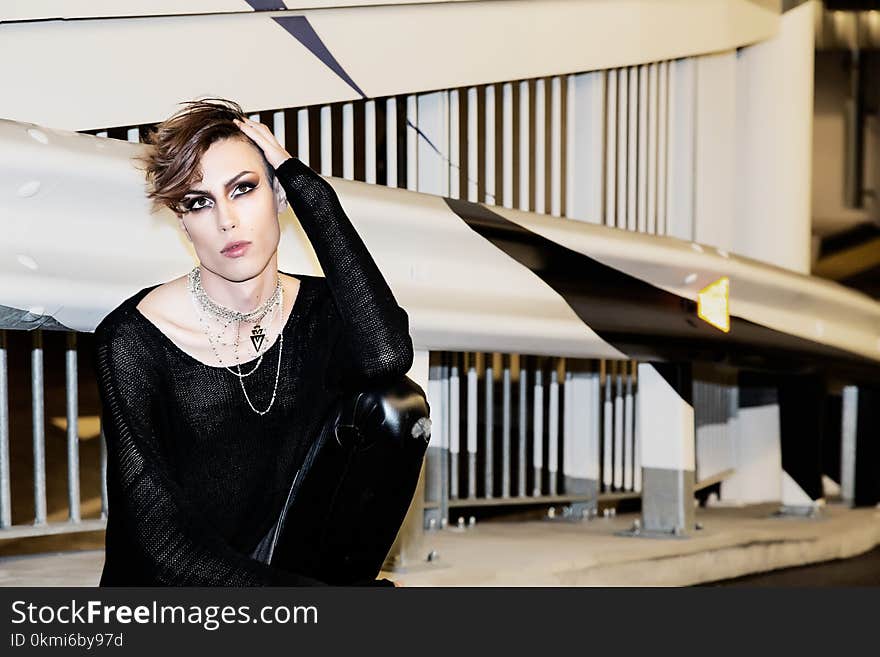 Woman Wearing Black Long-sleeved Shirt Near Grey and Black Wall