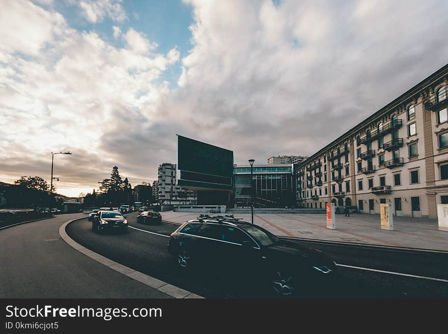 Black Car Near Concrete Building