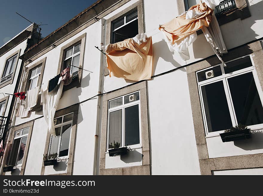 Clothes Hanged on Wire Beside House