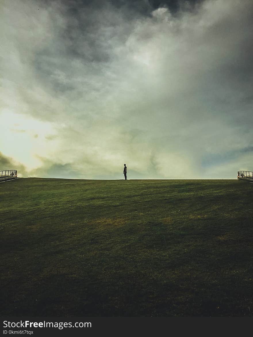 Person on Green Grass Field