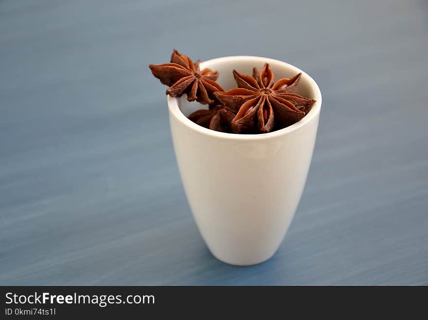 Brown Star Anise on White Ceramic Mug