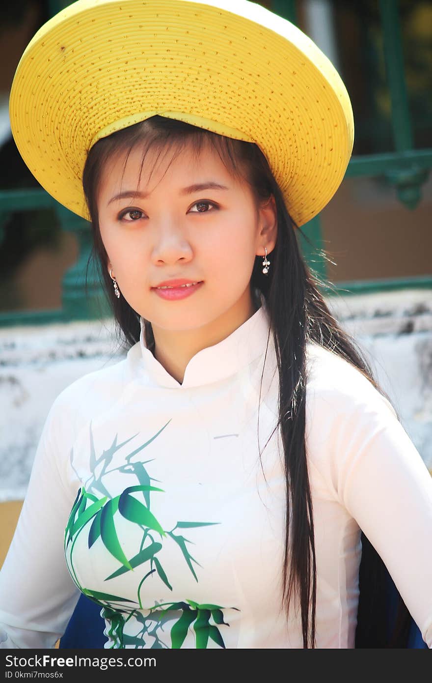 Woman Wearing White Long-sleeved Shirt and Yellow Hat