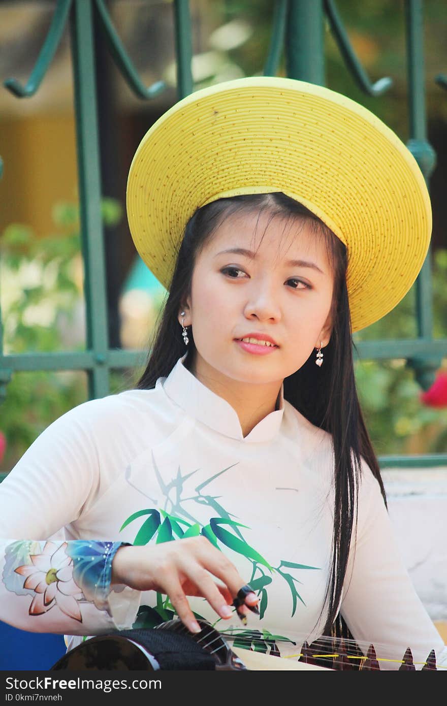 Woman in Beige, Green, and Pink Floral Long-sleeved Top With Yellow Hat