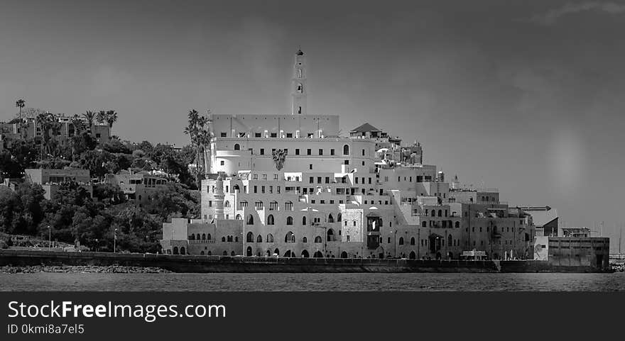 Grayscale Photo of White Concrete Building