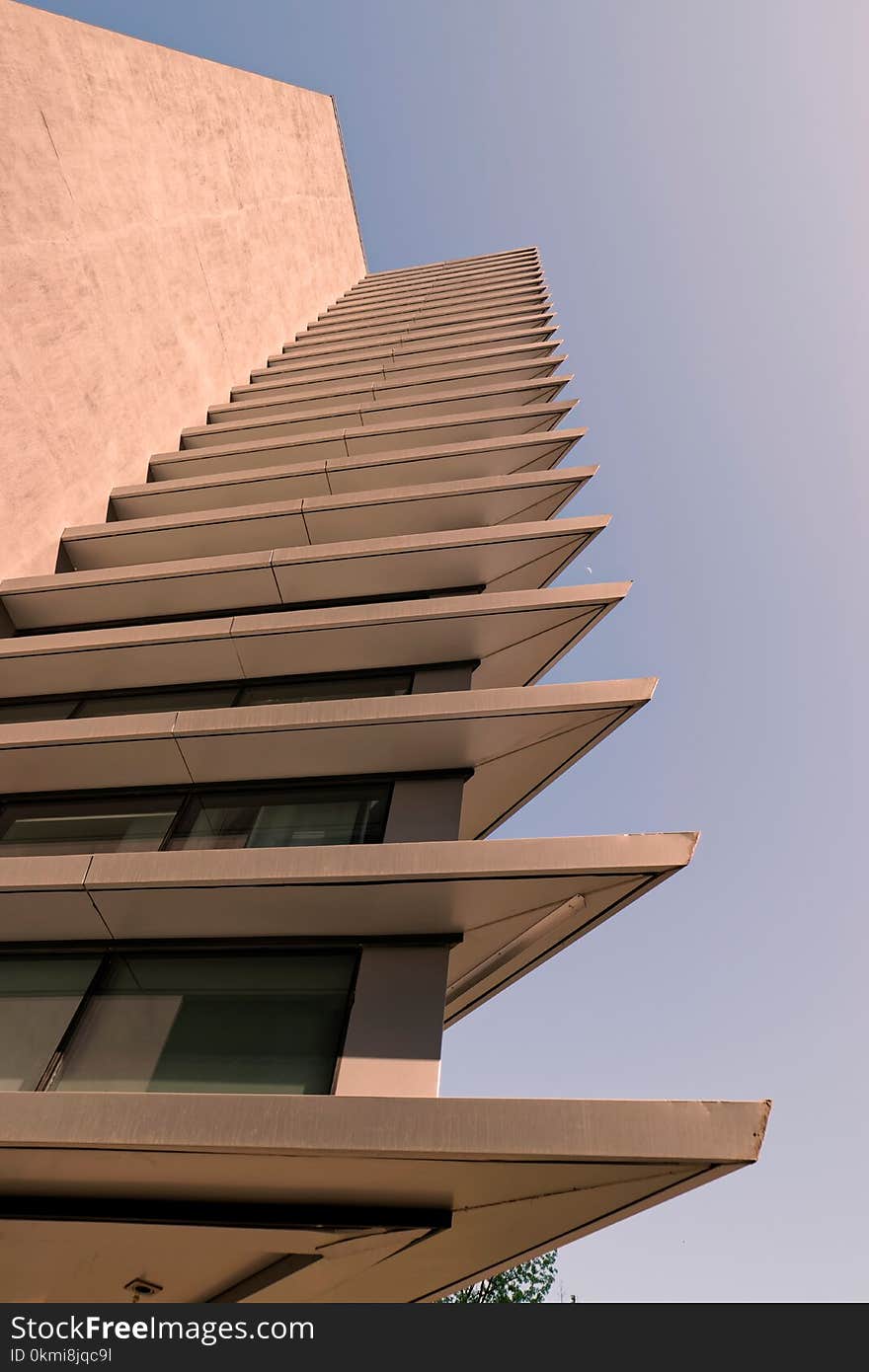 Low Angle Photo of Beige High Rise Building