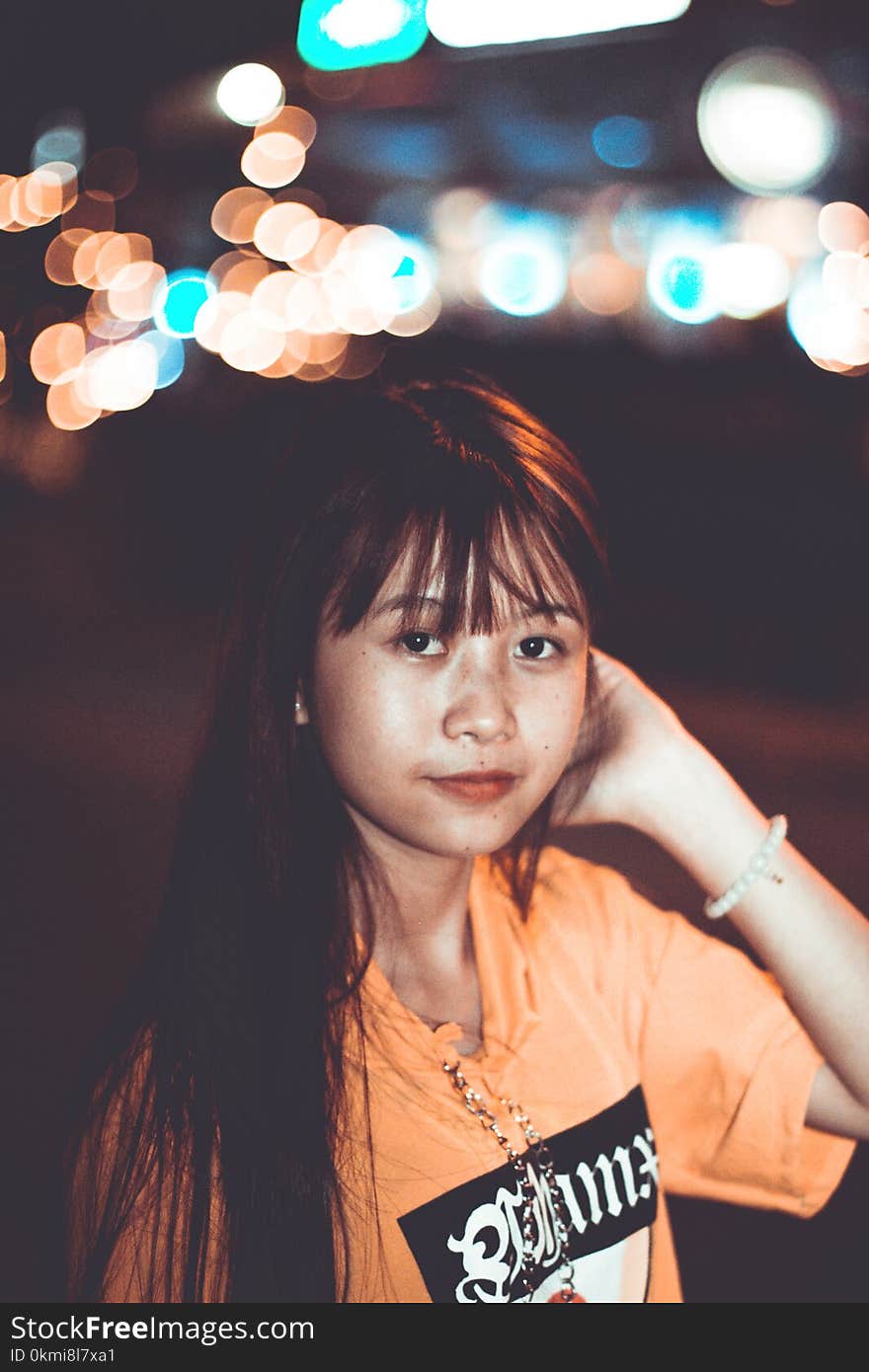 Woman Wearing Orange Crew-neck Top