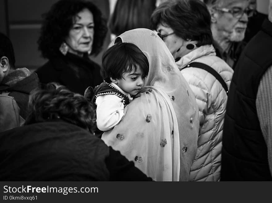 Grescale Photography of Woman Carrying Boy