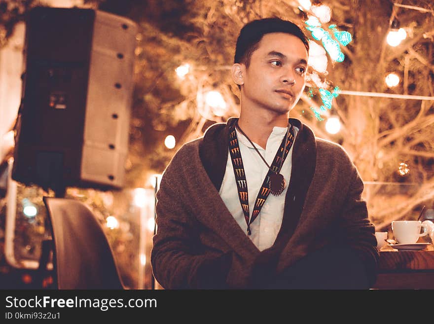 Man Wearing Black Jacket Standing Near Tree