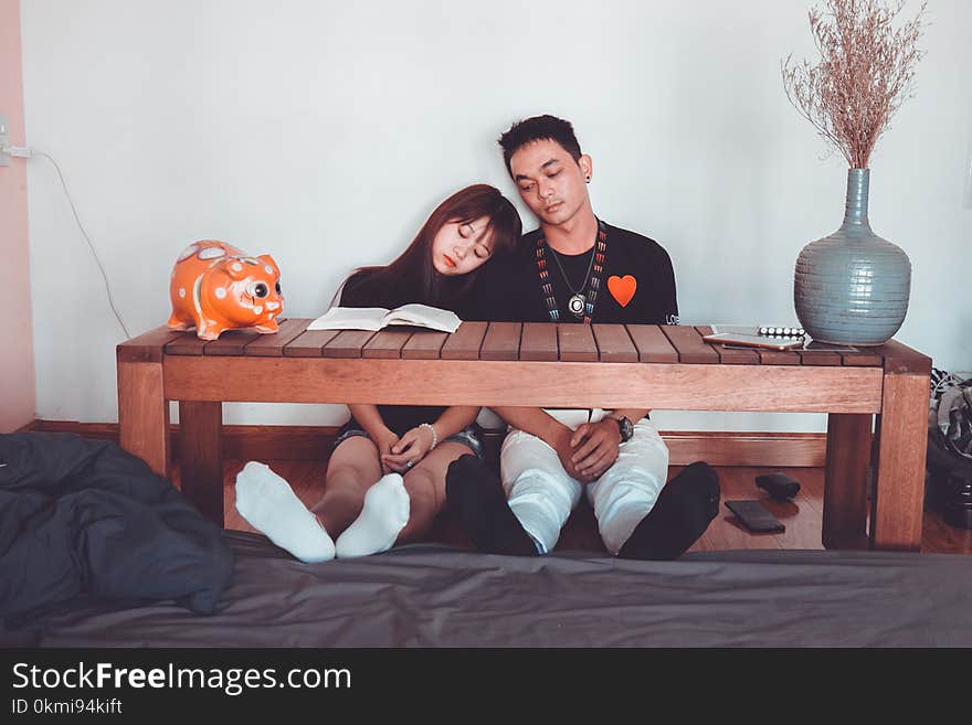 Sitting Woman and Man Wearing Black Crew-neck T-shirts