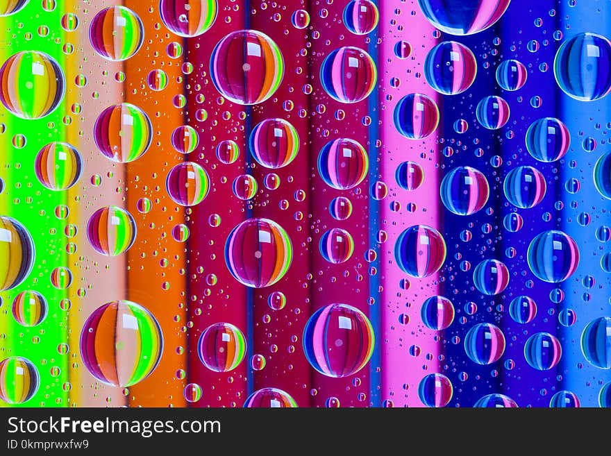 Color abstract background with drops and wooden pencils set