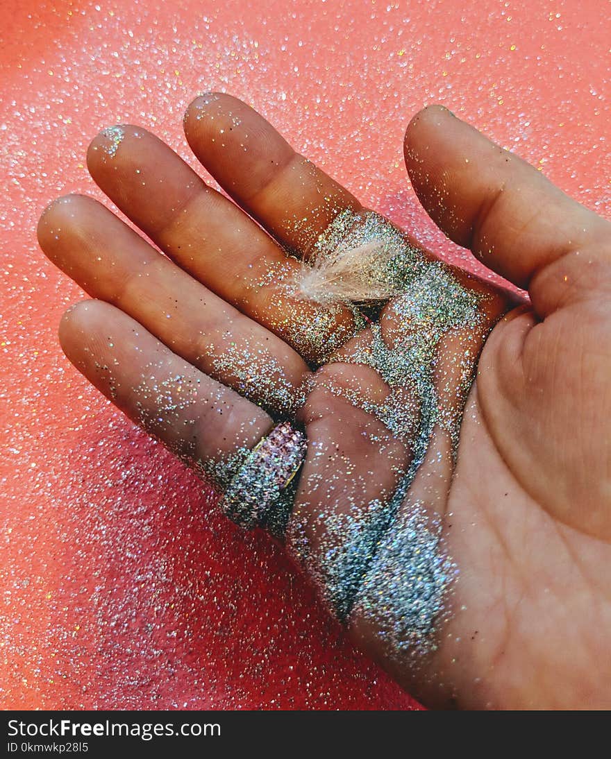 Person Holding Grey Glitter