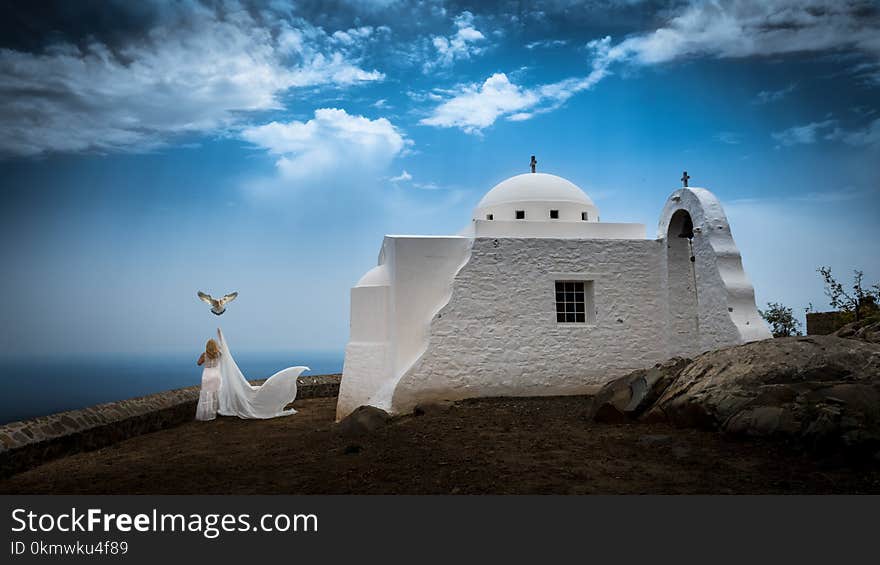 Woman Beside White Concrete Building