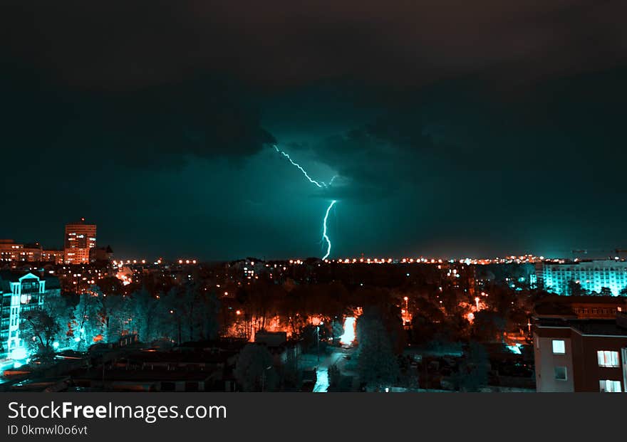 Aerial View of City With Thunder