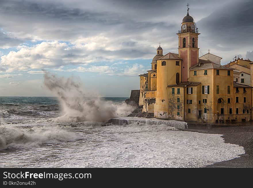 The Church And The Big Wave In Camogli Genoa, Italy.