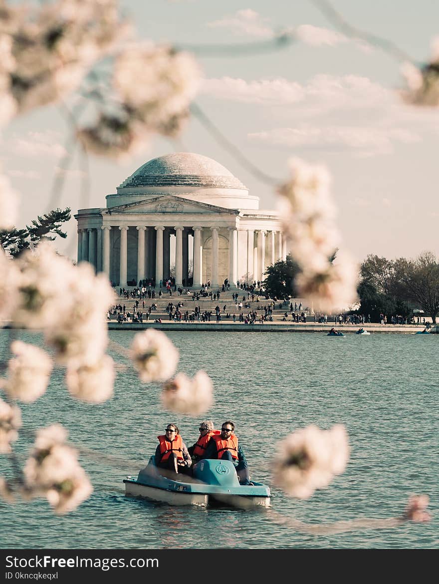 People Riding Pedal Boat